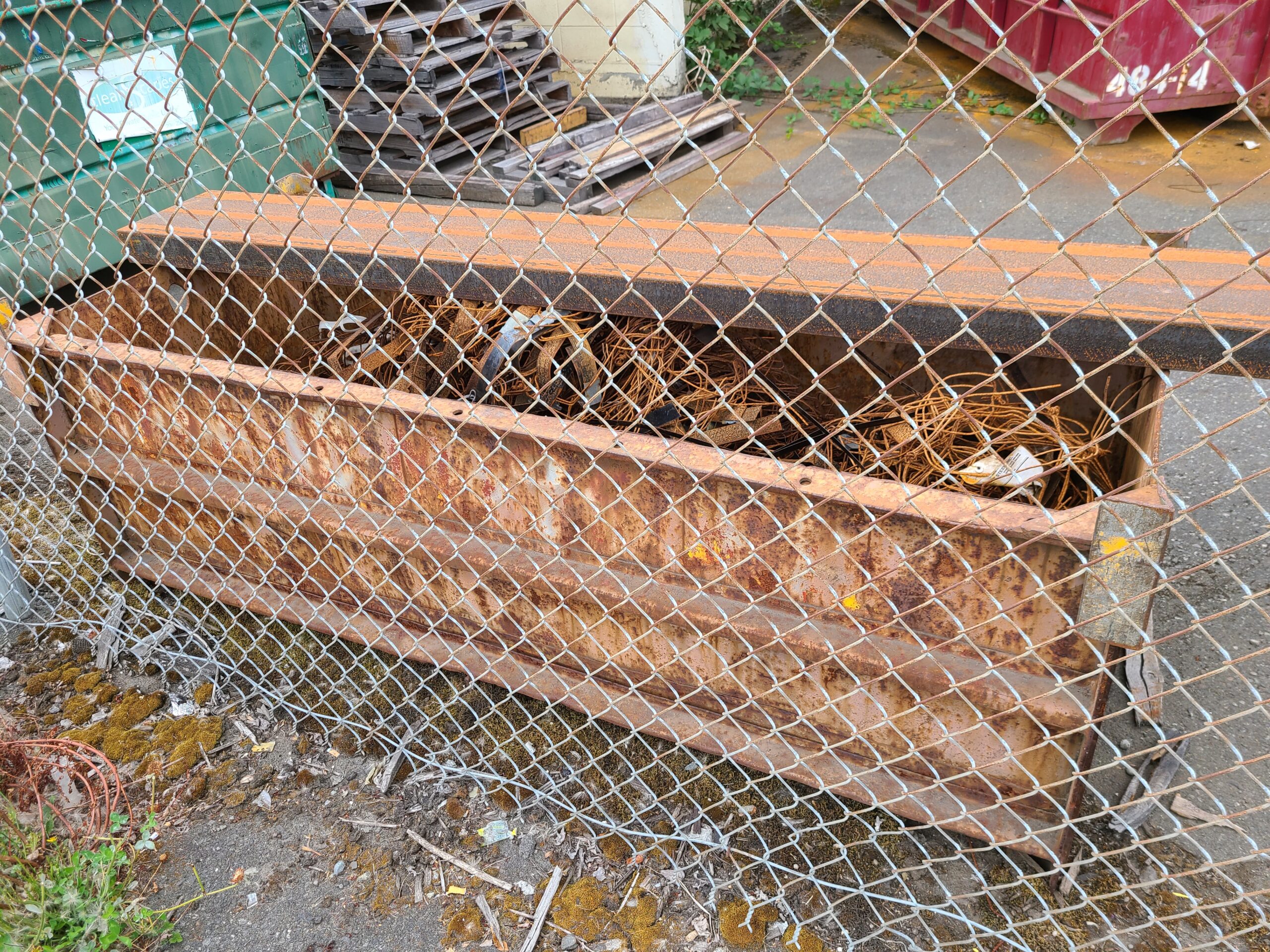 Figure 1: A steel bin full of rusted metal scraps.
